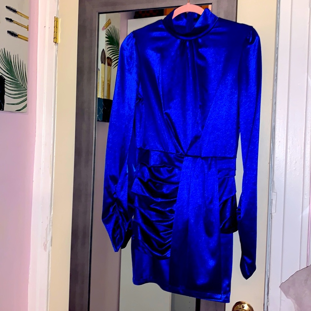 Electric blue mini dress. 31.5 inches from shoulder hem. Size medium. New.